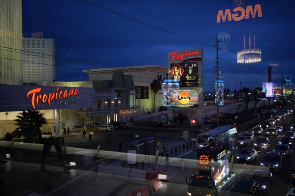Cars drive by the Tropicana hotel-casino along the Las Vegas Strip, Thursday, March 28, 2024, in Las Vegas. The property is scheduled to close April 2, 2024. (AP Photo/John Locher)