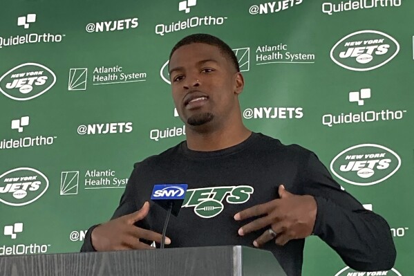 New York Jets cornerback D.J. Reed speaks to reporters at the team's NFL football facility in Florham Park, N.J., Wednesday, July 19, 2023. The Jets report for training camp Wednesday with massive expectations and plenty of cameras watching their every move. (AP Photo/Dennis Waszak Jr.)
