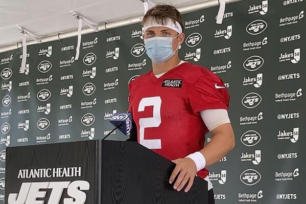 New York Jets rookie quarterback Zach Wilson speaks to reporters after his first practice at the NFL football team's training camp in Florham Park, N.J., Friday, July 30, 2021. (AP Photo/Dennis Waszak Jr.)