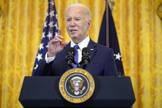 President Joe Biden speaks during a Women's History Month reception in the East Room of the White House, March 18, 2024, in Washington. Biden is embarking on a three-day campaign swing aimed at shoring up his standing in the Sun Belt as part of an aggressive play to re-energize vital parts of his 2020 electoral coalition. (AP Photo/Evan Vucci)