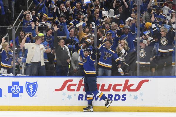 FILE - St. Louis Blues' Jordan Kyrou (25) celebrates after scoring a goal during the second period in Game 4 of an NHL hockey Stanley Cup first-round playoff series against the Minnesota Wild, Sunday, May 8, 2022, in St. Louis. The St. Louis Blues have signed forward Jordan Kyrou to an eight-year contract extension worth $65 million, the organization's latest move to keep its top young players in the fold long term. General manager Doug Armstrong announced the deal Tuesday, Sept. 13, 2022. (AP Photo/Michael Thomas, File)