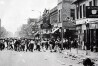 FILE - In this July 23, 1967 file photo, hundreds of people run down 12th Street on Detroit's westside throwing stones and bottles at storefronts. The riot started after police raided an after-hours club in a predominantly African-American neighborhood. The raid, though, was just the spark. Many in the community blamed frustrations blacks felt toward the mostly white police, and city policies that pushed families into aging and over-crowded neighborhoods. (ĢӰԺ Photo/File)