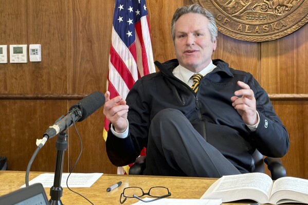 Alaska Gov. Mike Dunleavy gestures while speaking with reporters on Wednesday, May 1, 2024, in Juneau, Alaska. Dunleavy spoke on education issues and litigation around correspondence schools. (AP Photo/Becky Bohrer)