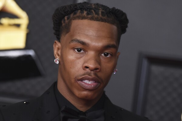 FILE - Lil Baby poses in the press room at the 63rd annual Grammy Awards at the Los Angeles Convention Center in Los Angeles on March 14, 2021. One person was shot and critically wounded at a concert headlined by rapper Lil Baby in Memphis, Tennessee, on Thursday night, Sept. 7, 2023, police and local media said.(Photo by Jordan Strauss/Invision/AP, File)