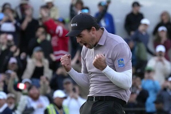 Nick Taylor, of Canada, celebrates his win over Charley Hoffman on the 18th green on the second playoff hole of the Phoenix Open golf tournament Sunday, Feb. 11, 2024, in Scottsdale, Ariz. (APPhoto/Ross D. Franklin)