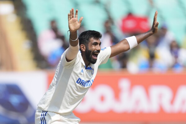 India's Jasprit Bumrah appeals successfully for the wicket of England's Zak Crawley on the fourth day of the third cricket test match between England and India in Rajkot, India, Sunday, Feb. 18, 2024. (AP Photo/Ajit Solanki)