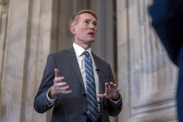 Sen. James Lankford, R-Okla., the lead GOP negotiator on the Senate border and foreign aid package, gives a TV news interview on Capitol Hill in Washington, Monday, Feb. 5, 2024.  (AP Photo/J. Scott Applewhite)