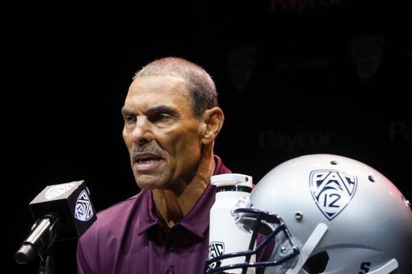 FILE - Arizona State coach Herm Edwards speaks during the Pac-12 Conference men's NCAA college football media day on July 29, 2022, in Los Angeles. Edwards was thought to be in the hot seat last season amid an NCAA investigation into recruiting practices, but athletic director Ray Anderson opted to bring him back for 2022. (AP Photo/Damian Dovarganes, File)
