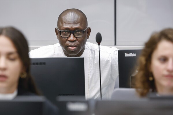 Maxime Jeoffroy Eli Mokom Gawaka, an alleged coordinator of a predominantly Christian rebel group in the Central African Republic attends the International Criminal Court hearings in The Hague, Netherlands, Monday Aug. 22, 2023, for a preliminary hearing in his war crimes and crimes against humanity case. (Piroschka van de Wouw/Pool via AP)
