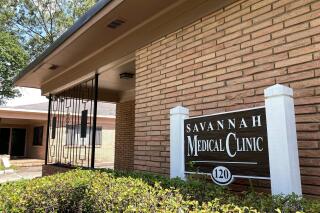 FILE - The recently closed Savannah Medical Clinic, which provided abortions for four decades in Savannah, Ga., is pictured on Thursday, July 21, 2022. According to an analysis released Thursday, Oct 6, 2022, at least 66 clinics have stopped providing abortions in 15 states since the U.S. Supreme Court overturned Roe v Wade on June 24, 2022. The Guttmacher Institute’s analysis examines the impact of state laws on access to U.S. abortion in the 100 days since that landmark decision. The number of abortion clinics in these states dropped in that time from 79 to 13 and all 13 of the remaining ones are in Georgia. (AP Photo/Russ Bynum, File)