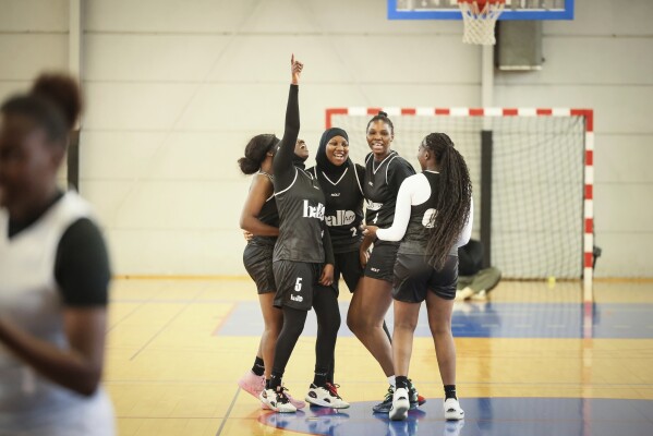 Players react during a basketball game in Aubervilliers near Paris, Sunday, April 27, 2025. (AP Photo/Thomas Padilla)