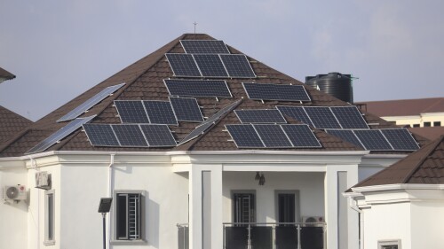 Solar panels on the rooftop of a house in Abuja Abuja, Nigeria. Saturday June 17, 2023. Nigeria's removal of a subsidy that helped reduce the price of gasoline has increased costs for people already struggling with high inflation. But it also potentially accelerates progress toward reducing emissions in Africa's largest economy. (AP Photo/Olamikan Gbemiga)