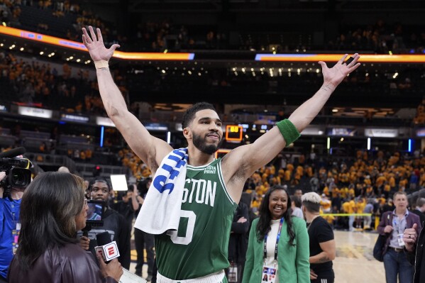 Boston Celtics forward Jayson Tatum celebrates after Game 3 of the NBA Eastern Conference basketball finals against the Indiana Pacers, Saturday, May 25, 2024, in Indianapolis. The Celtics won 114-111.(AP Photo/Michael Conroy)