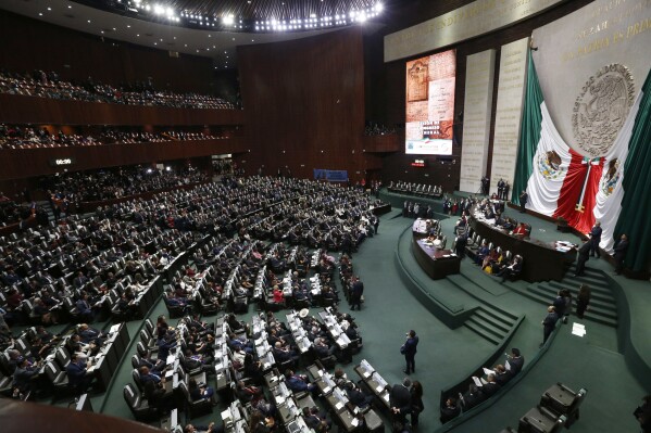 FILE - Legislators fill the lower house of Congress as the wait for inauguration ceremony of President-elect Andres Manuel Lopez Obrador, at the National Congress in Mexico City, Dec 1, 2018. Experts from Mexico, the United States, Japan and Brazil gathered before the Mexican Congress on Sept. 12, 2023 to share their findings on the existence of UFOs and extraterrestrials that date back to 2017 in the sandy Peruvian coastal desert of Nazca. (AP Photo/Marco Ugarte, File)