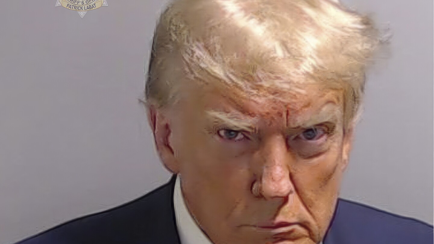 Mug shot of Donald Trump shows scowling former president during speedy booking at Atlanta jail