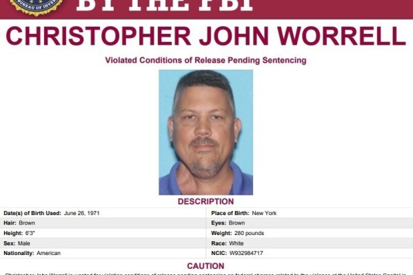 This image released by the FBI shows the wanted poster for Christopher Worrell. Authorities are searching for Worrell, a member of the Proud Boys extremist group, who disappeared days before his sentencing in a U.S. Capitol riot case, where prosecutors are seeking more than a decade in prison, according to a warrant made public Friday, Aug. 18, 2023. (FBI via AP)