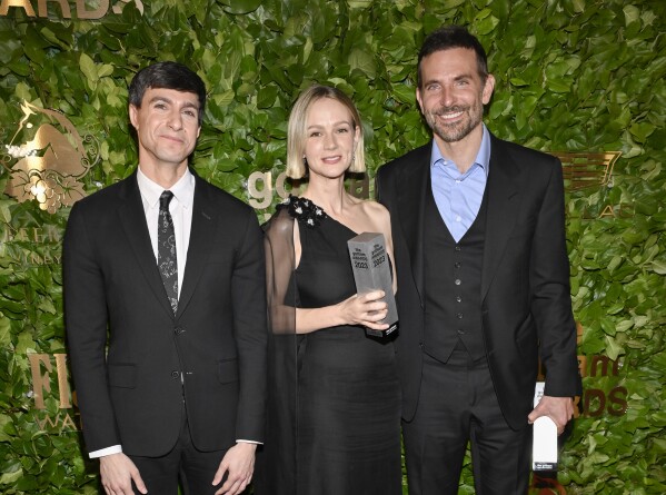 Gideon Glick, left, Carey Mulligan, center, and Bradley Cooper pose in the winner's room at Gotham Independent Film Awards at Cipriani Wall Street on Monday, Nov. 27, 2023, in New York. (Photo by Evan Agostini/Invision/AP)