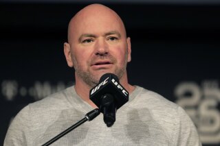 FILE - In this Nov. 2, 2018, file photo, UFC president Dana White speaks at a news conference in New York. When White first proposed holding mixed martial arts fights on an isolated island during the early weeks of the worldwide sports shutdown, fans and haters alike imagined waves lapping at an octagon perched amid palm trees on a white sand beach. A few months later, the project that came to be known as Fight Island is real, and ready for competition. And while it's not literally on a beach, the octagon at Abu Dhabi's Yas Island is inside a bubble that seems highly unlikely to burst. (AP Photo/Julio Cortez, File)
