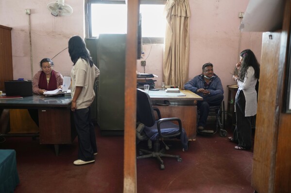 Register at the left Khendo Tamang and Nirmala Pariyar, right, at Rehabilitation Centre and change the height of the prosthetic leg in Kathmandu, Nepal on Friday, April 11, 2025.