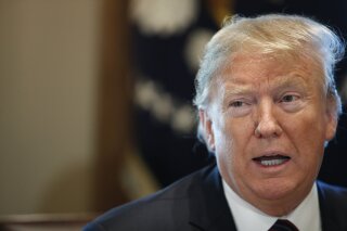President Donald Trump leads a roundtable discussion on border security with local leaders, Friday, Jan. 11, 2019, in the Cabinet Room of the White House in Washington. (AP Photo/Jacquelyn Martin)