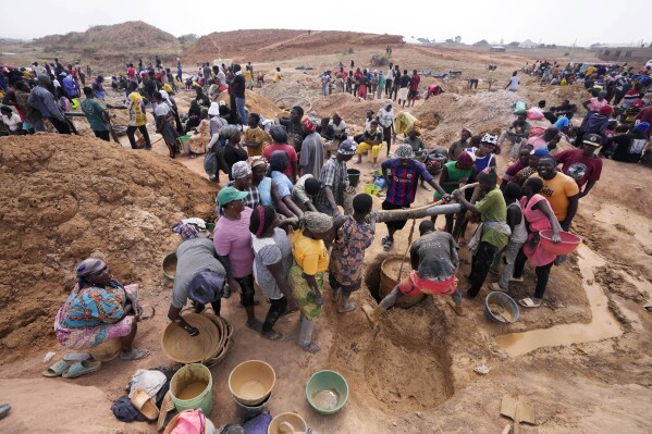 Miners work at an illegal tin mining site in Jos, Nigeria, Wednesday, April 3, 2024. The recent arrests come as Nigeria seeks to regulate mining of critical minerals, curb illegal activity and better benefit from its mineral resources. (AP Photo/Sunday Alamba)