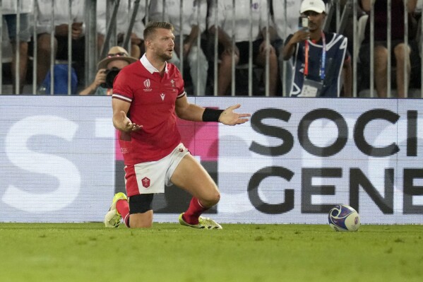 Wales' Dan Biggar reacts after his try attempt was disallowed during the Rugby World Cup Pool C match between Wales and Fiji at the Stade de Bordeaux in Bordeaux, France, Sunday, Sept. 10, 2023. (AP Photo/Themba Hadebe)