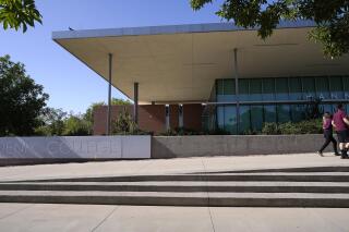 FILE - The exterior of Phoenix College, part of the Maricopa County Community College system, is seen in this photo Tuesday, May 4, 2021, in Phoenix. Non-citizen students at schools like Phoenix College would benefit from Proposition 308, which Arizona voters will be weighing this November. The proposition would allow students regardless of their immigration status to obtain financial aid and cheaper in-state tuition at state universities and community colleges. (AP Photo/Ross D. Franklin,File)