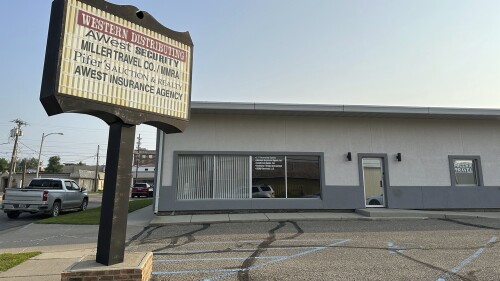 A company sign is posted outside the office of Western Distributing Company, Monday, July 10, 2023, in Bismarck, N.D. The company and two affiliates are gambling equipment distributors whom North Dakota Attorney General Drew Wrigley accused in April of violating the state's gambling laws and regulations, a complaint that resulted in a recent settlement that included a $125,000 fine and acknowledgment of wrongdoing. (AP Photo/Jack Dura)