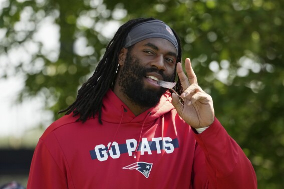 New England Patriots linebacker Matthew Judon walks onto the field during a joint NFL football practice with the Philadelphia Eagles, Tuesday, Aug. 13, 2024, in Foxborough, Mass. (AP Photo/Michael Dwyer)