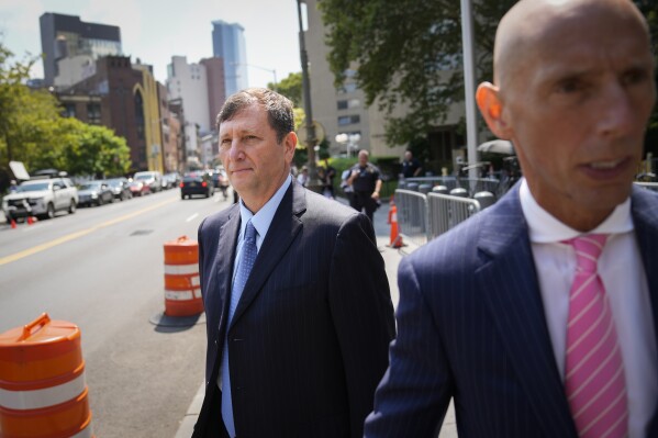 Alexander Mashinsky, founder and former chief executive of the failed cryptocurrency lending platform Celsius Network, leaves Manhattan federal court with his legal team, Tuesday, July 25, 2023, in New York. (AP Photo/John Minchillo, File)