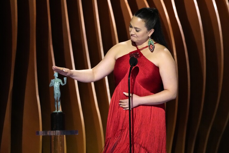 Lily Gladstone accepts the award for outstanding performance by a female actor in a leading role for "Killers of the Flower Moon" during the 30th annual Screen Actors Guild Awards on Saturday, Feb. 24, 2024, at the Shrine Auditorium in Los Angeles. (AP Photo/Chris Pizzello)