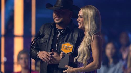 Jason Aldean, left, and Carrie Underwood accept the award for video of the year for "If I Didn't Love You" at the CMT Music Awards on Monday, April 11, 2022, at the Municipal Auditorium in Nashville, Tenn. (AP Photo/Mark Humphrey)