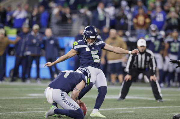 Seattle Seahawks place kicker Jason Myers (5) kicks a field goal in the second half of an NFL football game against the Washington Commanders in Seattle, Sunday, Nov. 12, 2023. (AP Photo/John Froschauer)