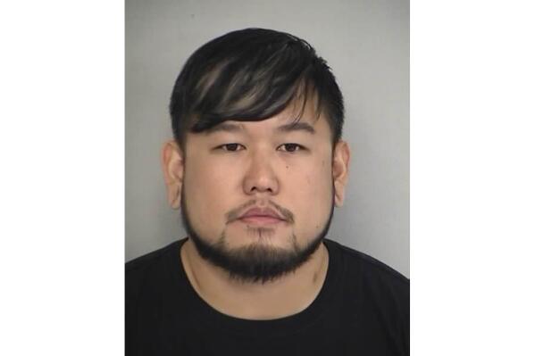 FILE - This Dec. 4, 2015 file law enforcement booking photo provided by the North Las Vegas Police Department shows Jimmy Carter Kim. Kim, who pleaded guilty in state and federal courts to crimes stemming from the abduction and rape of two teenage girls six years ago was sentenced Tuesday, Aug. 31, 2021, to about 15 more years in federal prison and lifetime supervision as a top-tier sex offender. (North Las Vegas Police Department via AP, File)