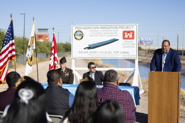 In this image provided by the Gila River Indian Community, Gov. Stephen Roe Lewis gives a speech during the signing of an agreement with the U.S. Army Corps of Engineers to put solar panels over a stretch of irrigation canal on the tribe’s land near Chandler, Ariz., Nov. 9, 2023. (Gila River Indian News via AP)