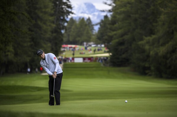 Matthew Fitzpatrick of Great Britain in action during the first round of the Omega European Masters Golf Tournament DP World Tour, in Crans-Montana, Switzerland, Thursday, Aug. 31, 2023. (Jean-Christophe Bott/Keystone via AP)