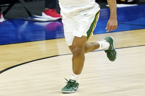 Baylor's MaCio Teague celebrates after scoring against Hartford during the first half of a college basketball game in the first round of the NCAA tournament at Lucas Oil Stadium in Indianapolis Friday, March 19, 2021, in Indianapolis, Tenn. (AP Photo/Mark Humphrey)