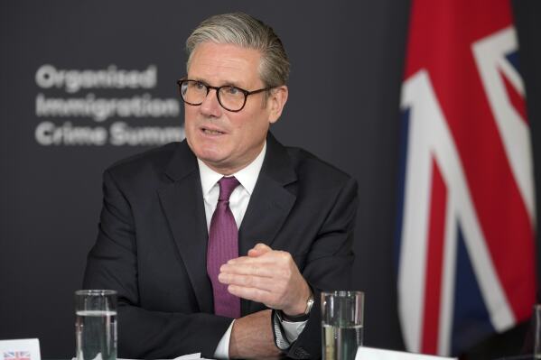 Britain's Prime Minister Keir Starmer leads a roundtable discussion at the Border Security Summit in London, Monday, March 31, 2025.(AP Photo/Kin Cheung, Pool)