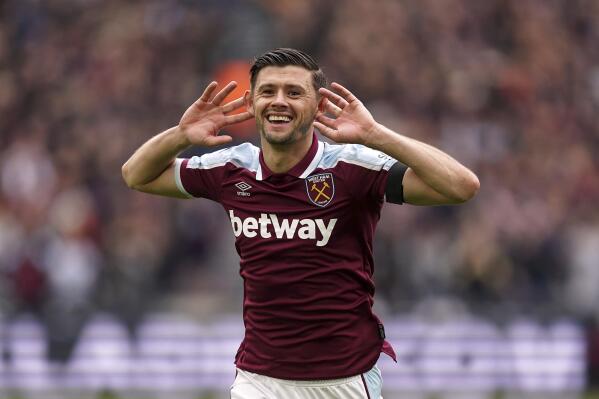 West Ham United's Aaron Cresswell celebrates scoring their side's first goal of the game during the English Premier League soccer match between West Ham United and Everton at the London Stadium, London, Sunday, April 3, 2022. (Mike Egerton/PA via AP)