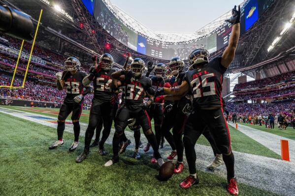 Atlanta Falcons cornerback Dee Alford, (37) celebrates his interception with teammates after his interception during the second half of an NFL football game against the Cleveland Browns, Sunday, Oct. 2, 2022, in Atlanta. The Atlanta Falcons won 23-20. (AP Photo/Danny Karnik)
