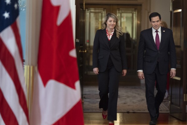 Secretary of State Marco Rubio and Canada's Minister of Foreign Affairs Mélanie Joly walk towards the Treaty Room at the State Department, Wednesday, Jan. 29, 2025. (AP Photo/Manuel Balce Ceneta)