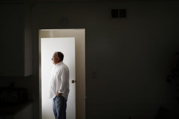 David Lasher stands for a portrait at his home in Carlsbad, Calif., on Friday, Oct. 4, 2019. When Lasher reported sexual abuse by a priest to an independent review board, the board ruled against him. (AP Photo/Gregory Bull)