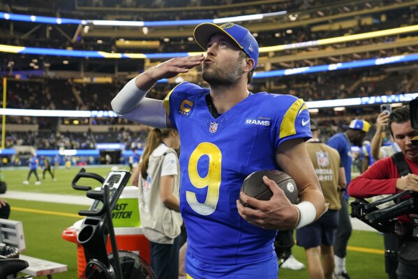 Los Angeles Rams quarterback Matthew Stafford walks off the field after a win over the New Orleans Saints in an NFL football game Thursday, Dec. 21, 2023, in Inglewood, Calif. (AP Photo/Ashley Landis)