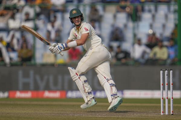 Australia's captain Pat Cummins plays a shot during the first day of the second cricket test match between India and Australia in New Delhi, India, Friday, Feb. 17, 2023. (AP Photo/Altaf Qadri)