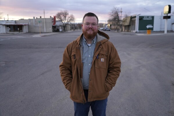 Ren Hatt, the mayor of Green River, Utah, poses for a photo, Friday, Jan. 26, 2024. An Australian company and its U.S. subsidiaries are eyeing a nearby area to extract lithium, metal used in electric vehicle batteries. Hatt said the town's limited economic base puts pressure to accept the project. (AP Photo/Brittany Peterson)