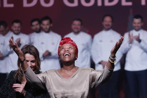 Georgiana Viou celebrates her star during the 2023 Michelin Guide ceremony in Strasbourg, eastern France, Monday, March 6, 2023. The self-taught chef from the west African country Benin, whose dream was to go to France to become an interpreter, was awarded a star on Monday by the Michelin Guide, the bible of gastronomy, for her cuisine at a restaurant in Nimes, southern France. (AP Photo/Jean-Francois Badias)