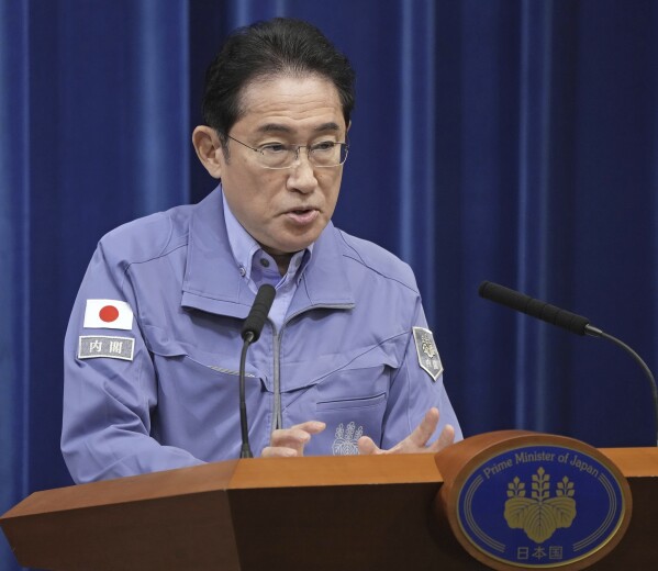 Japanese Prime Minister Fumio Kishida speaks to the media during a prime minister’s official office in Tokyo, Japan Wednesday, Jan. 3, 2024. (Kyodo News via AP)