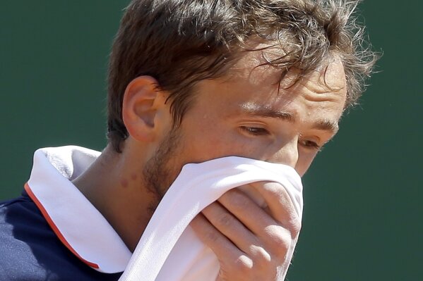 
              Russia's Daniil Medvedev wipes his face during their semifinal match against Serbia's Dusan Lajovic of the Monte Carlo Tennis Masters tournament in Monaco, Saturday, April 20, 2019. (AP Photo/Claude Paris)
            