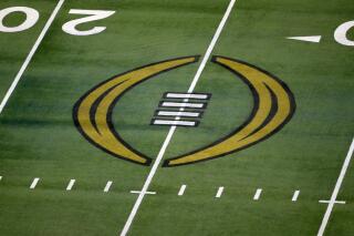 FILE - The College Football Playoff logo is shown on the field at AT&T Stadium before the Rose Bowl NCAA college football game between Notre Dame and Alabama in Arlington, Texas, Jan. 1, 2021. The most positive development at the latest meeting on expanding the College Football Playoff was that the people involved agreed to keep talking. There is no firm date for the next meeting, but there is one regularly schedule for January around the College Football Playoff championship game. (AP Photo/Roger Steinman, File)
