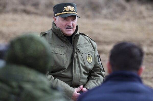 FILE - In this photo provided by the Belarusian Presidential Press Service, Belarus President Alexander Lukashenko speaks to military personnel during his visit to Oshmyany District, Grodno region of Belarus on Tuesday, March 26, 2024. Three activists of Viasna, the main human rights group in Belarus, have been arrested and charged with participating in an extremist organization, state television reported Thursday, April 4. (Belarusian Presidential Press Service via AP, File)